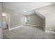 Spacious bedroom boasts neutral paint, natural light from the window, and an entrance to the bathroom at 2223 Copper Pond Way, Fuquay Varina, NC 27526