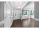Bright foyer with dark wood flooring, an elegant chandelier, and neutral paint at 2223 Copper Pond Way, Fuquay Varina, NC 27526