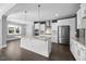 Modern kitchen featuring stainless steel appliances and a large center island at 2223 Copper Pond Way, Fuquay Varina, NC 27526