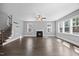 Spacious open-concept living room with a fireplace and abundant natural light at 2223 Copper Pond Way, Fuquay Varina, NC 27526