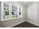 Office area with lots of light coming through the windows and dark hardwood floors at 2223 Copper Pond Way, Fuquay Varina, NC 27526