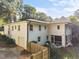 Two-story home featuring a white brick exterior, an attached garage, and a fenced-in yard at 227 W Drewry Ln, Raleigh, NC 27609