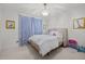 Bright bedroom with charming décor, soft carpet, and colorful furnishings at 227 W Drewry Ln, Raleigh, NC 27609