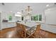 Open kitchen features a large island with seating, modern appliances, and a stunning view at 227 W Drewry Ln, Raleigh, NC 27609
