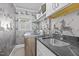 Laundry room features custom shelving, modern appliances, and stylish zebra-print wallpaper at 227 W Drewry Ln, Raleigh, NC 27609