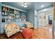 Stylish room features custom built-in shelving, hardwood floors, and bright furnishings at 227 W Drewry Ln, Raleigh, NC 27609