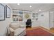 Bright home office featuring built-in shelving and cabinetry, and a decorative area rug at 227 W Drewry Ln, Raleigh, NC 27609