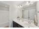 Bright bathroom featuring double vanity, walk-in shower and toilet in separate enclosure at 2323 Pindos Dr, Cary, NC 27519