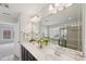 Bathroom features dual sinks, large mirror, and separate shower and tub at 2323 Pindos Dr, Cary, NC 27519
