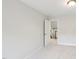 Carpeted bedroom with an open door at 2323 Pindos Dr, Cary, NC 27519