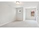 Carpeted bedroom with a large window at 2323 Pindos Dr, Cary, NC 27519