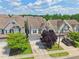 Beautiful front exterior with a two-car garage, well-maintained landscaping, and stone accents at 2323 Pindos Dr, Cary, NC 27519