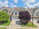 Exterior view of home with attached garage, neutral siding, and well-maintained landscaping at 2323 Pindos Dr, Cary, NC 27519