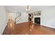Open living room with a fireplace and hardwood flooring at 2323 Pindos Dr, Cary, NC 27519