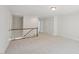 Carpeted loft features a staircase and multiple doors at 2323 Pindos Dr, Cary, NC 27519