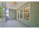 The view from the screened in porch into the dining area and to the adjacent porch at 2323 Pindos Dr, Cary, NC 27519