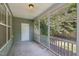 A screened porch with a view of the trees outside at 2323 Pindos Dr, Cary, NC 27519