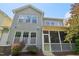 The back exterior of the home features multiple windows and a screened in porch at 2323 Pindos Dr, Cary, NC 27519