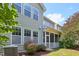 The back exterior of the home features multiple windows and a screened in porch at 2323 Pindos Dr, Cary, NC 27519