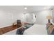 Spacious bedroom with hardwood floors, walk-in closet, and white walls at 2707 Anderson Dr, Raleigh, NC 27608