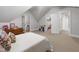 Bedroom featuring neutral walls and carpet with a view into a walk-in closet and secondary play area at 2707 Anderson Dr, Raleigh, NC 27608