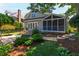 Exterior of home featuring a screened porch, wooden steps, patio, and professionally landscaped yard at 2707 Anderson Drive Dr, Raleigh, NC 27608