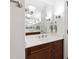 Bathroom with an expansive mirror, and sinks, modern lighting, and a dark wood vanity at 2707 Anderson Drive Dr, Raleigh, NC 27608