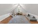 Bedroom with a playful teepee, stylish rug, and a comfortable sofa for relaxation and recreation at 2707 Anderson Drive Dr, Raleigh, NC 27608