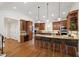 Modern kitchen with stainless steel appliances, a center island, and breakfast bar seating at 2707 Anderson Drive Dr, Raleigh, NC 27608
