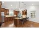 Spacious kitchen featuring stainless steel appliances, wood cabinets, granite countertops, and a large island at 2707 Anderson Drive Dr, Raleigh, NC 27608