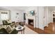 Inviting living room with a brick fireplace, hardwood floors, and comfortable seating at 2707 Anderson Drive Dr, Raleigh, NC 27608