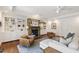Cozy living room with a stone fireplace, built-in shelving, and stylish furniture at 2707 Anderson Drive Dr, Raleigh, NC 27608