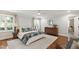 Bright main bedroom boasts hardwood floors, natural light, and ensuite bathroom access at 2707 Anderson Drive Dr, Raleigh, NC 27608