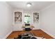 Bright office space featuring custom built-in shelving and hardwood floors, offering a great work-from-home environment at 2707 Anderson Drive Dr, Raleigh, NC 27608