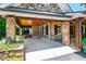 Spacious portico with stone columns, recessed lighting, and a beautiful wood ceiling at 2707 Anderson Drive Dr, Raleigh, NC 27608