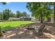 Beautiful backyard with fire pit, seating area, and partial view of the home at 2816 Keck Dr, Burlington, NC 27215