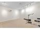 Finished basement space with neutral carpet and track lighting at 2816 Keck Dr, Burlington, NC 27215