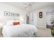 Bedroom with neutral decor featuring a ceiling fan, three pictures and access to an ensuite bathroom at 2816 Keck Dr, Burlington, NC 27215