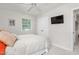 Bedroom featuring natural light, a ceiling fan, and a television mounted on the wall at 2816 Keck Dr, Burlington, NC 27215