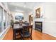 Spacious dining room featuring a fireplace, hardwood floors, and lots of natural light at 2816 Keck Dr, Burlington, NC 27215