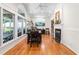 Elegant dining room with large windows, a fireplace, and hardwood flooring at 2816 Keck Dr, Burlington, NC 27215