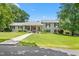 Charming home with a well-manicured lawn and inviting walkway leading to the covered front porch at 2816 Keck Dr, Burlington, NC 27215