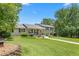 Well-maintained home with mature trees and a large lawn at 2816 Keck Dr, Burlington, NC 27215