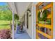 Up close view of the front porch with rocking chairs and a stylish wood front door at 2816 Keck Dr, Burlington, NC 27215