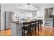 Modern kitchen with stainless steel appliances, granite countertops, and island seating for three at 2816 Keck Dr, Burlington, NC 27215