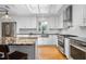 Modern kitchen with white cabinets, stainless steel appliances, and marble countertops at 2816 Keck Dr, Burlington, NC 27215