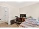 Bedroom featuring a neutral color palette, a window, and a wooden writing desk at 2998 Matthews Mill Pond Rd, Angier, NC 27501