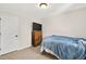 This bedroom features neutral carpet and walls, and a wooden dresser at 2998 Matthews Mill Pond Rd, Angier, NC 27501