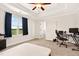 Bedroom with a tray ceiling, a bright window overlooking a field, and a workstation at 2998 Matthews Mill Pond Rd, Angier, NC 27501