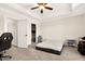 Spacious bedroom featuring a ceiling fan, walk-in closet, and neutral color palette at 2998 Matthews Mill Pond Rd, Angier, NC 27501